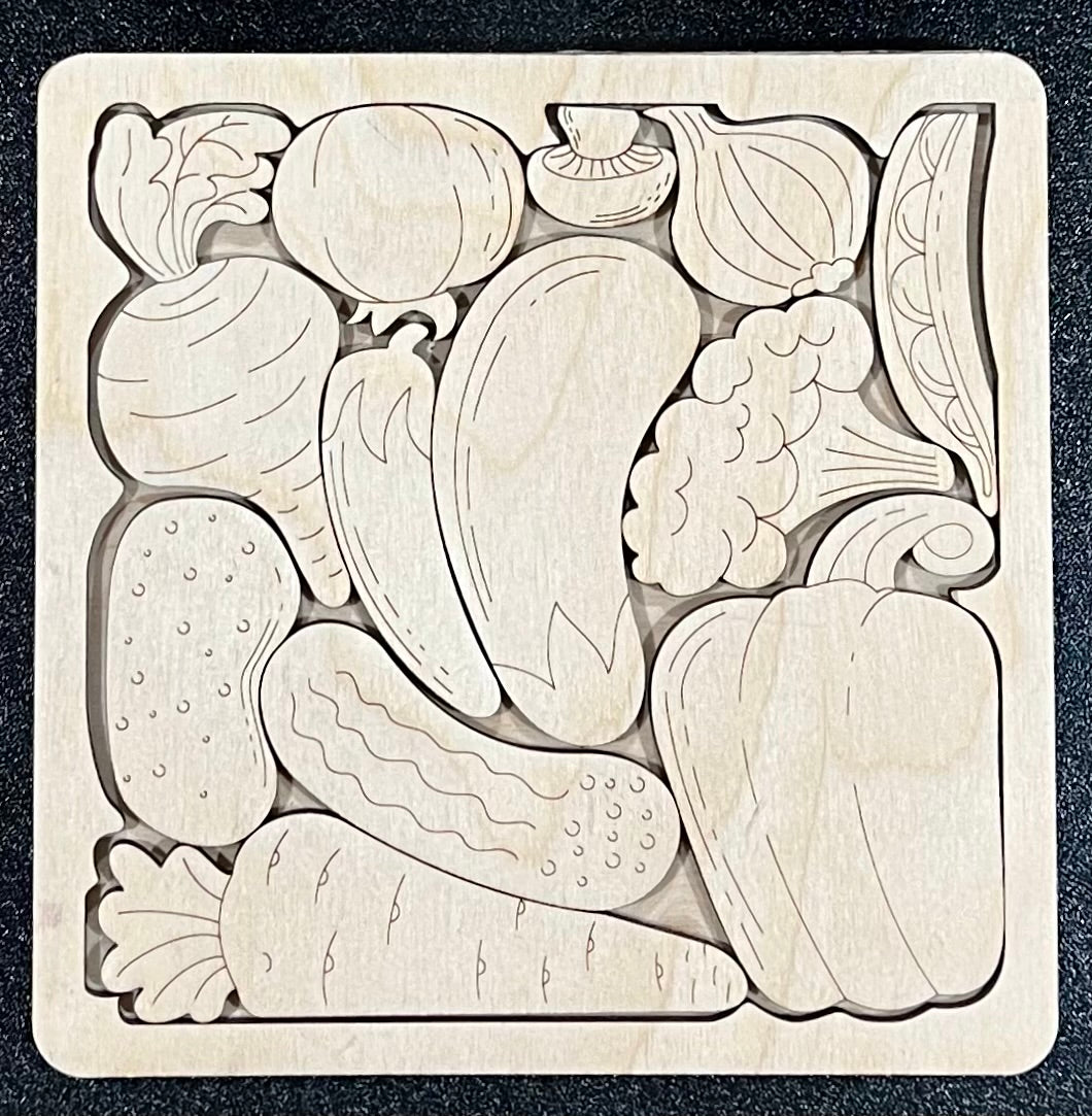 Unfinished wood square puzzle with 13 vegetable-shaped pieces.