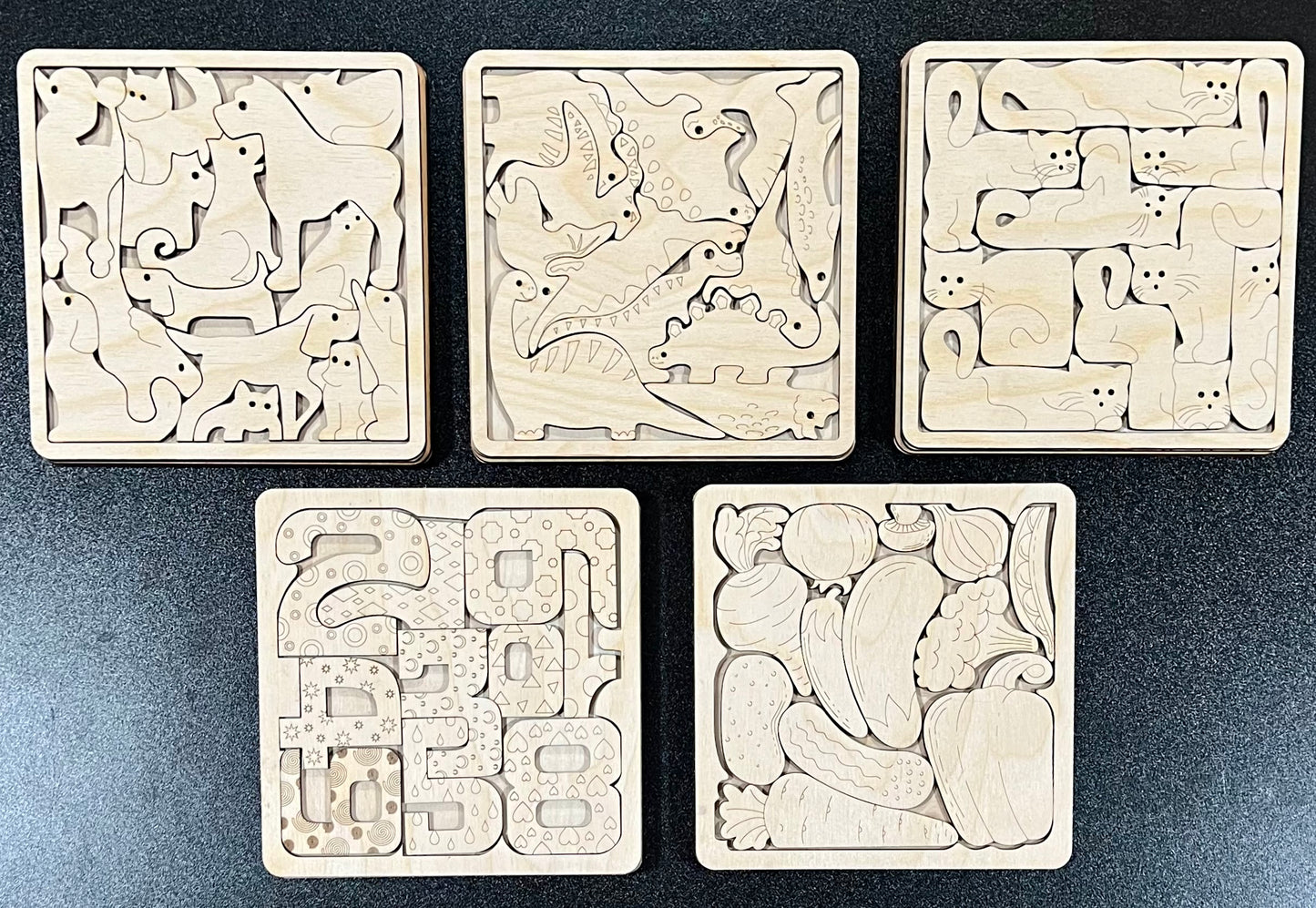 Five unfinished wood square puzzles, each with a different themed design.