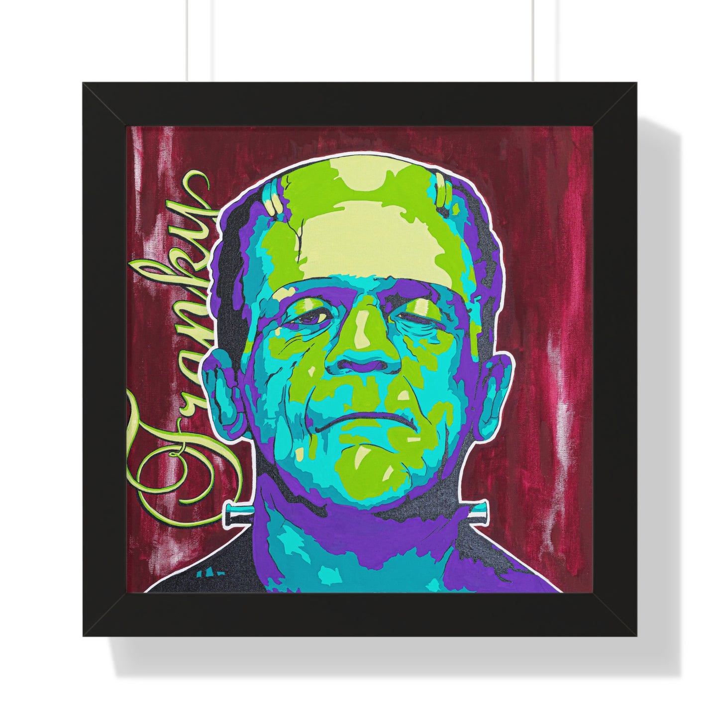 A framed poster features a colorful, pop-art style portrait of Frankenstein's monster.