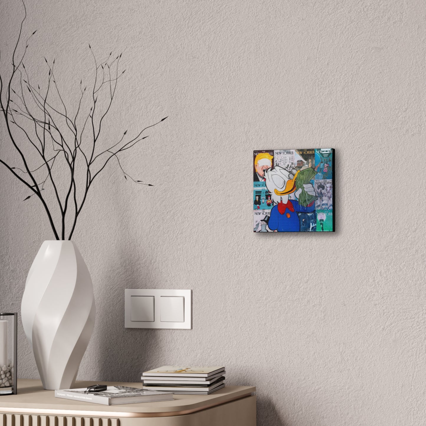 A canvas gallery wrap featuring a Donald Duck collage hangs on a textured wall.