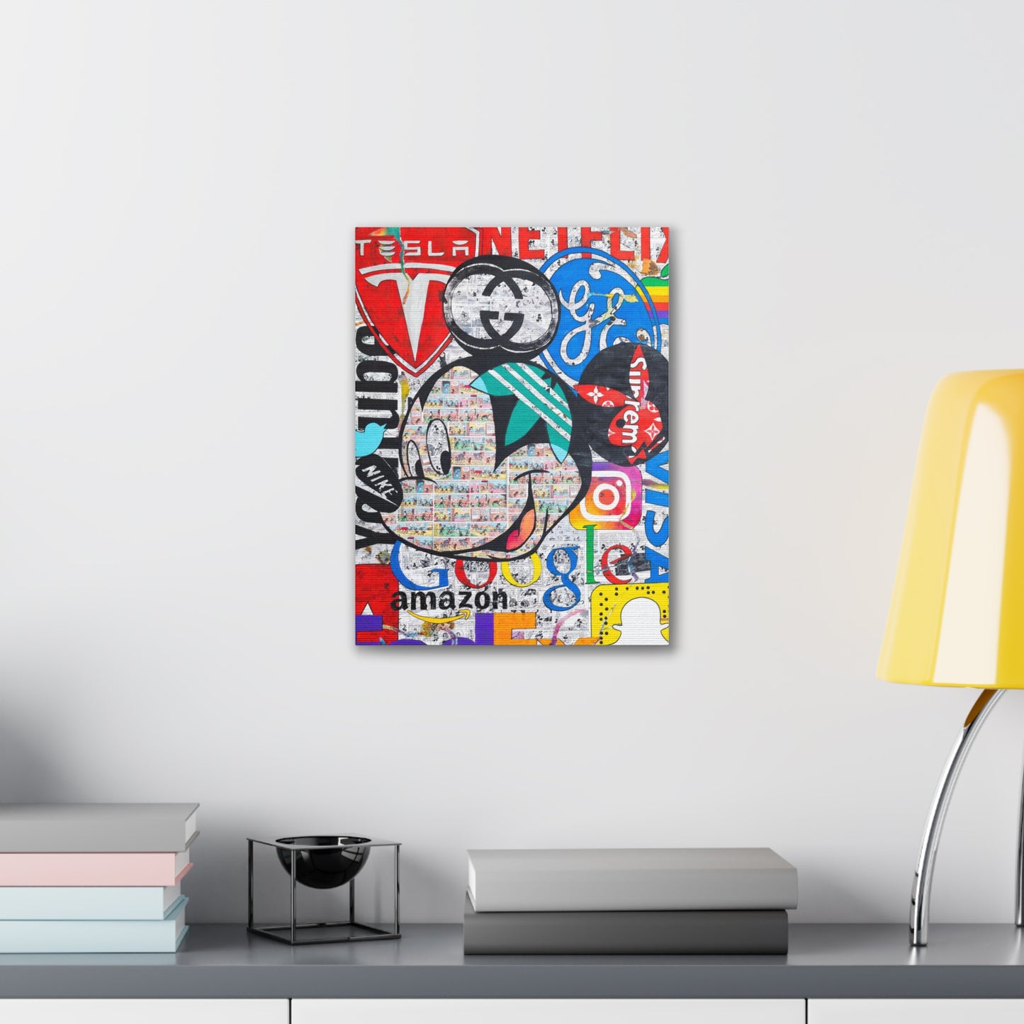 A canvas gallery wrap features a Mickey Mouse collage of brand logos.