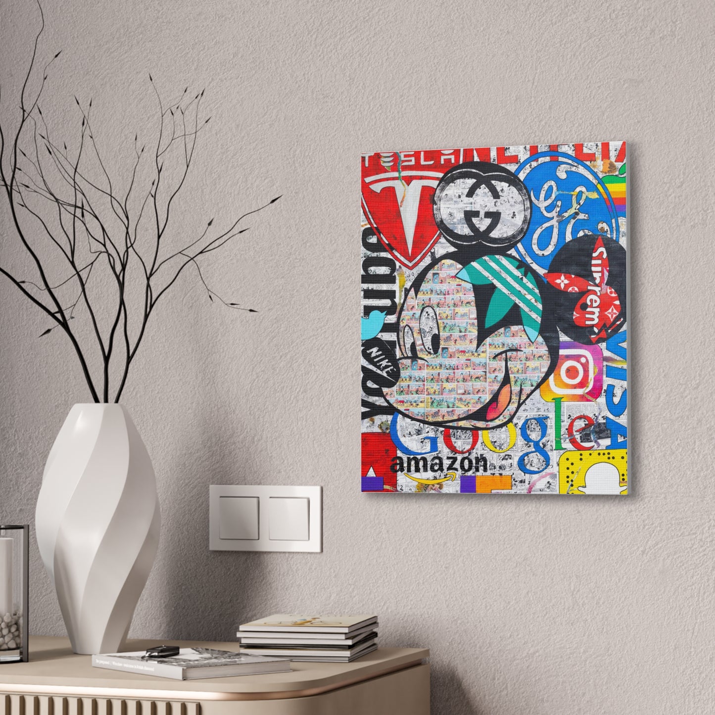 Mickey Mouse collage art canvas with various brand logos, displayed on a textured wall.