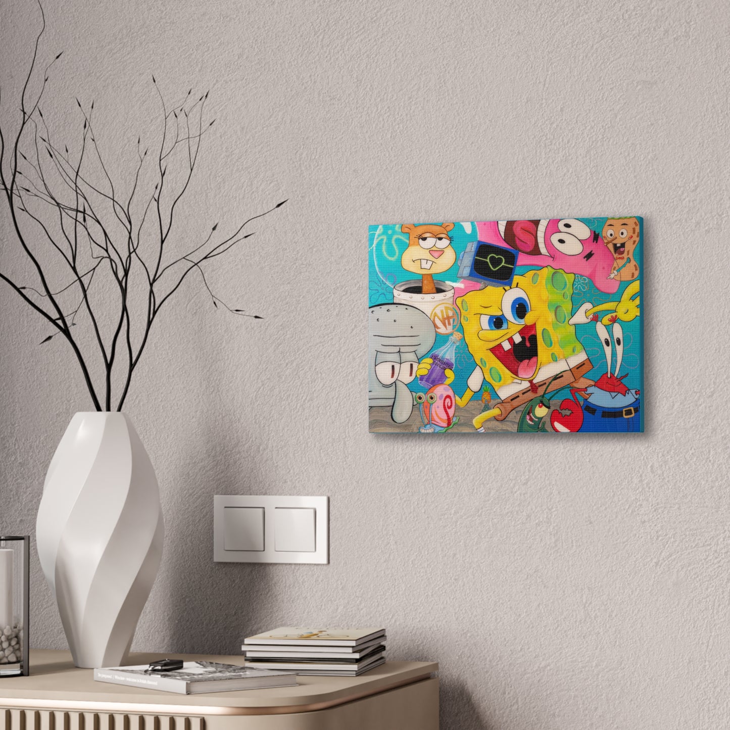 A canvas gallery wrap featuring SpongeBob SquarePants and other characters hangs on a wall.