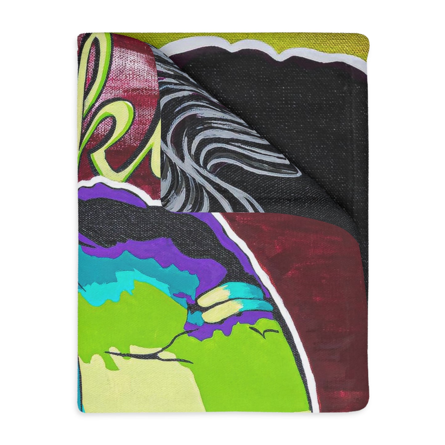 A velveteen blanket with a colorful abstract design, partially folded to show both sides.