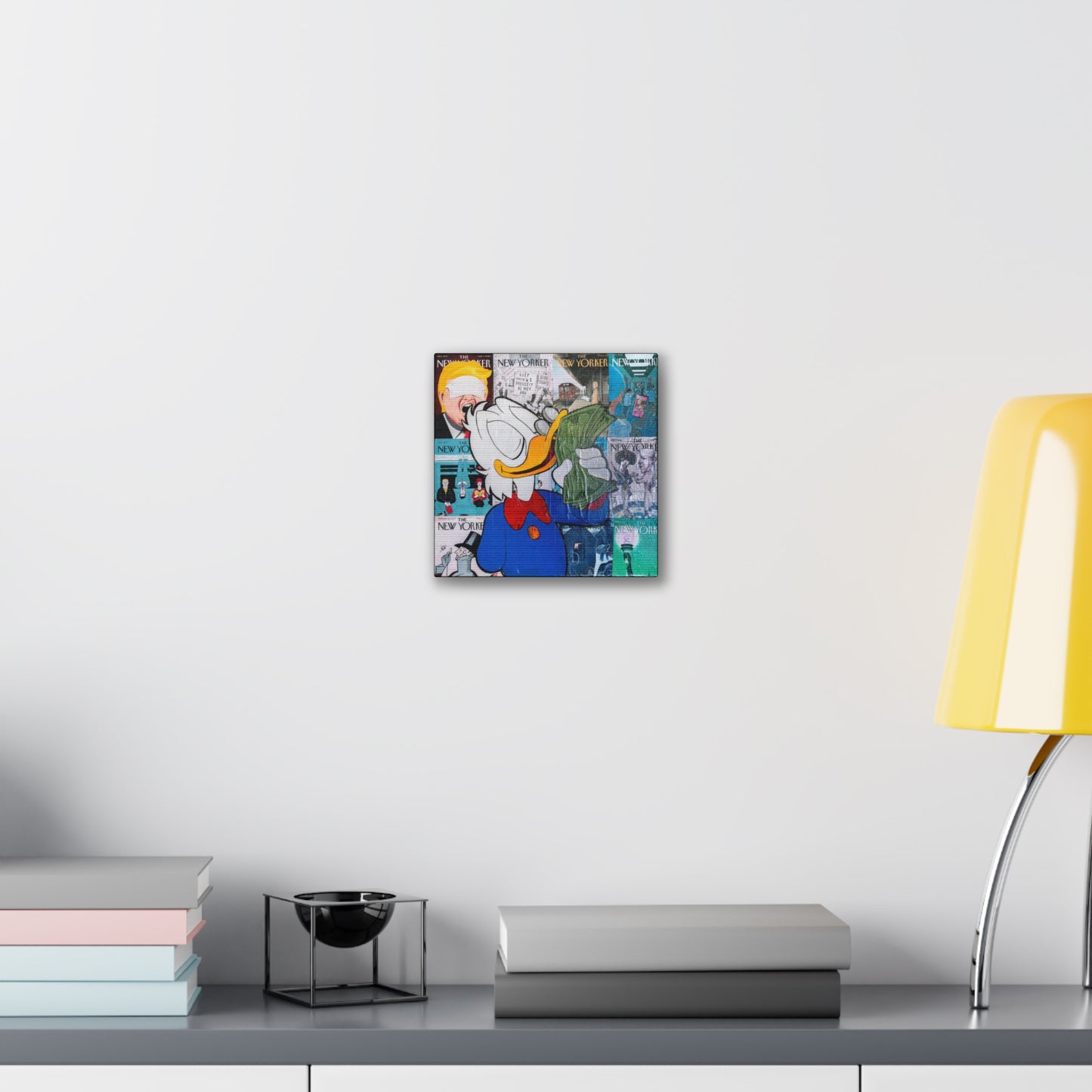 A canvas gallery wrap featuring a cartoon duck holding money, surrounded by New Yorker covers.