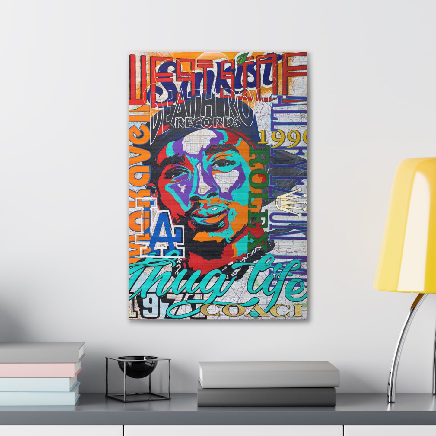 A colorful canvas gallery wrap featuring a pop art style portrait of Tupac Shakur.