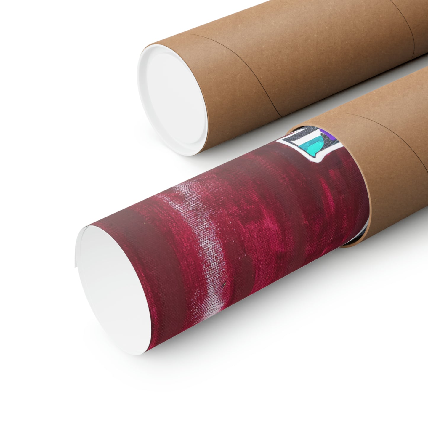 Two matte posters, one partially unrolled to reveal a vibrant abstract design.