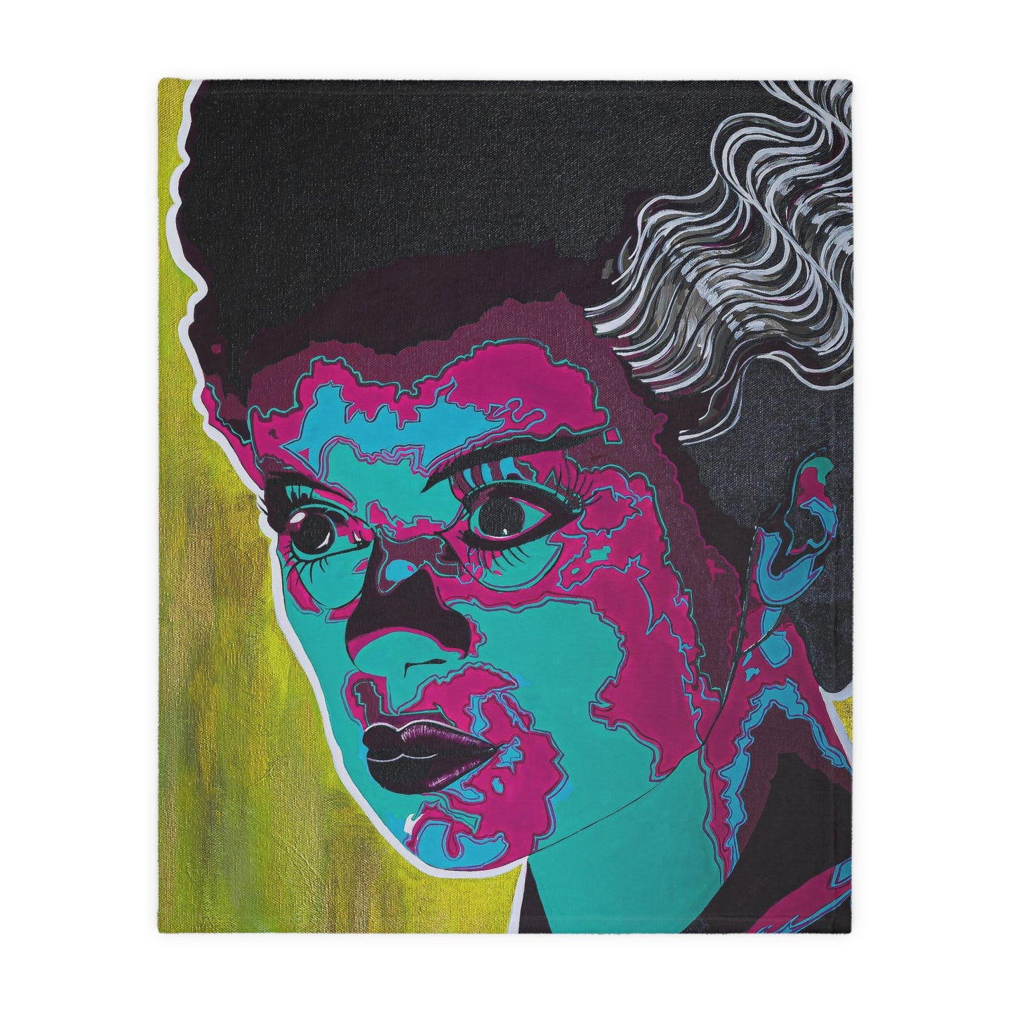 A velveteen blanket features a pop art style portrait of the Bride of Frankenstein in teal and magenta.