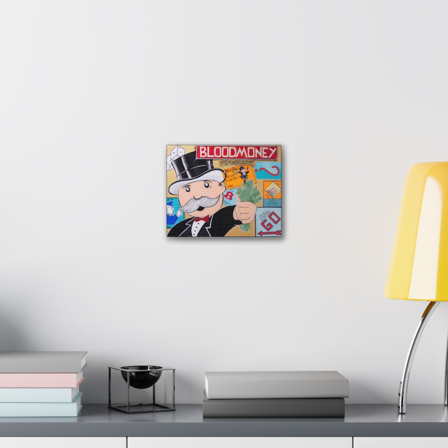 A canvas gallery wrap featuring a Monopoly man holding money with "BLOODMONEY" above him.