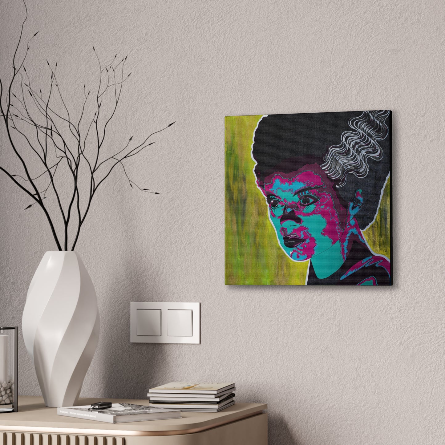 A canvas print of Franky's Bride in pop art style hangs on a textured wall.