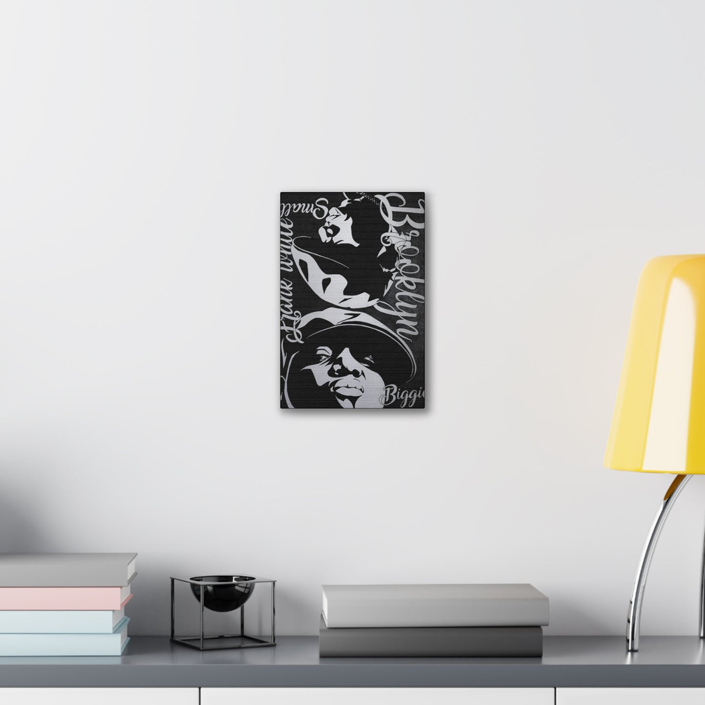 A black and white canvas gallery wrap featuring two stylized portraits of Biggie Smalls.