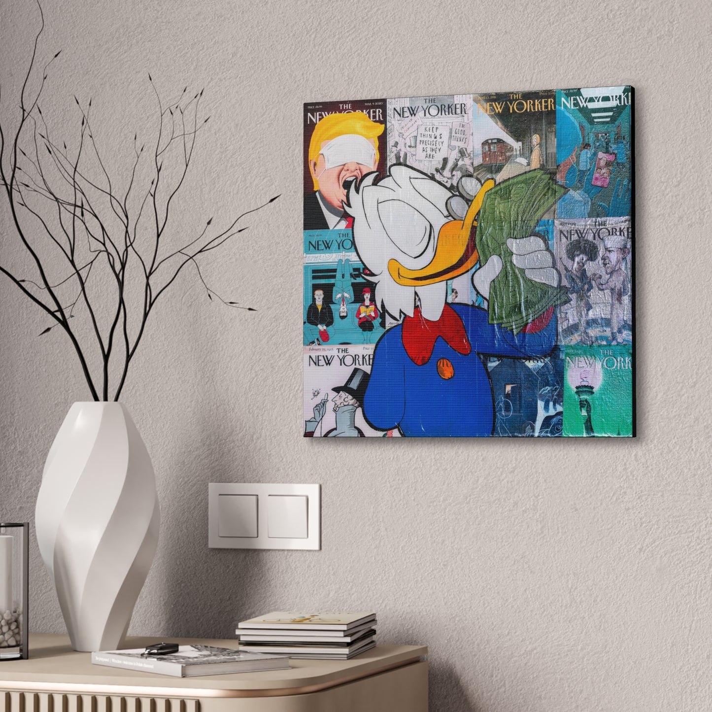 A canvas gallery wrap features a collage of New Yorker covers with Donald Duck holding money.