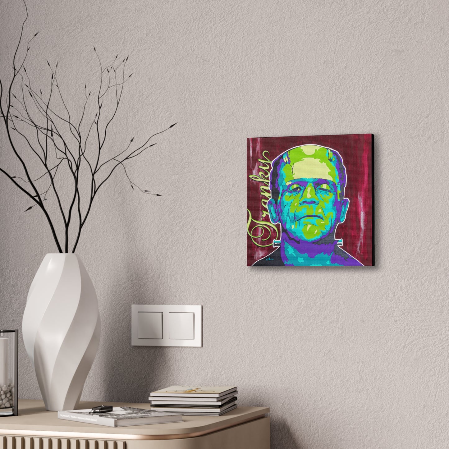 A vibrant pop art canvas of Frankenstein's monster hangs on a textured wall.