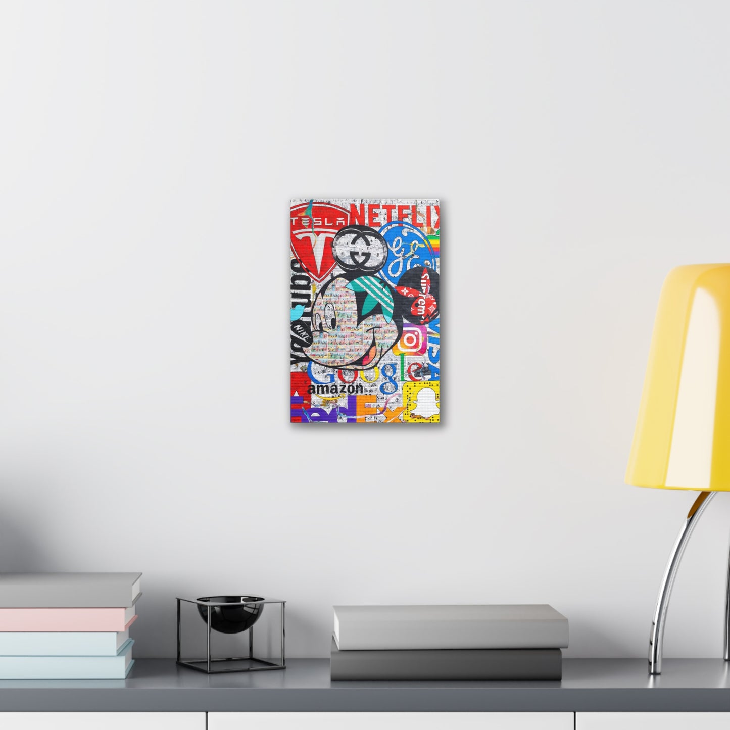A canvas gallery wrap featuring a Mickey Mouse collage of brand logos.