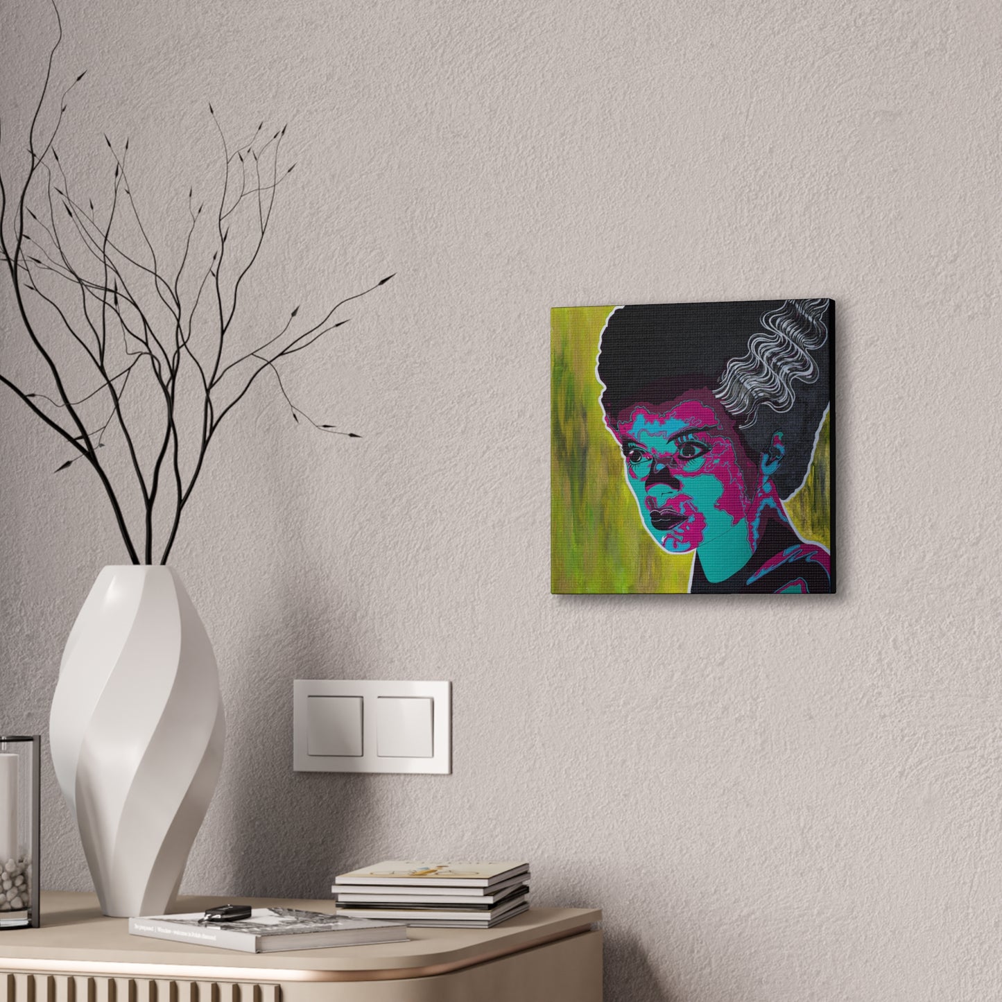 A vibrant pop art canvas of Franky's Bride hangs on a textured wall.