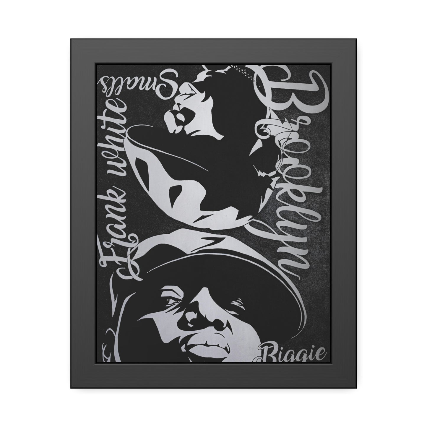 A black framed poster features a black and white illustration of two figures and text.