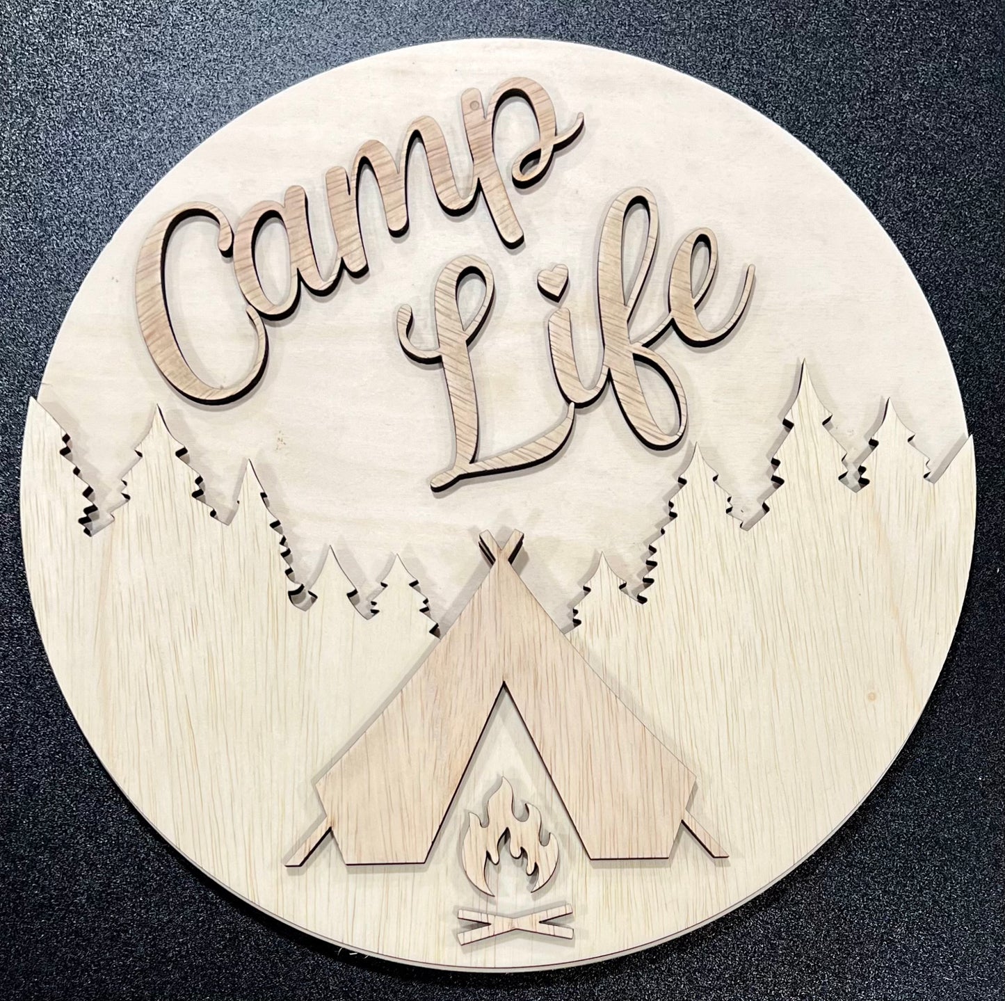 Unpainted wood sign with "Camp Life" text, trees, a tent, and a campfire design.