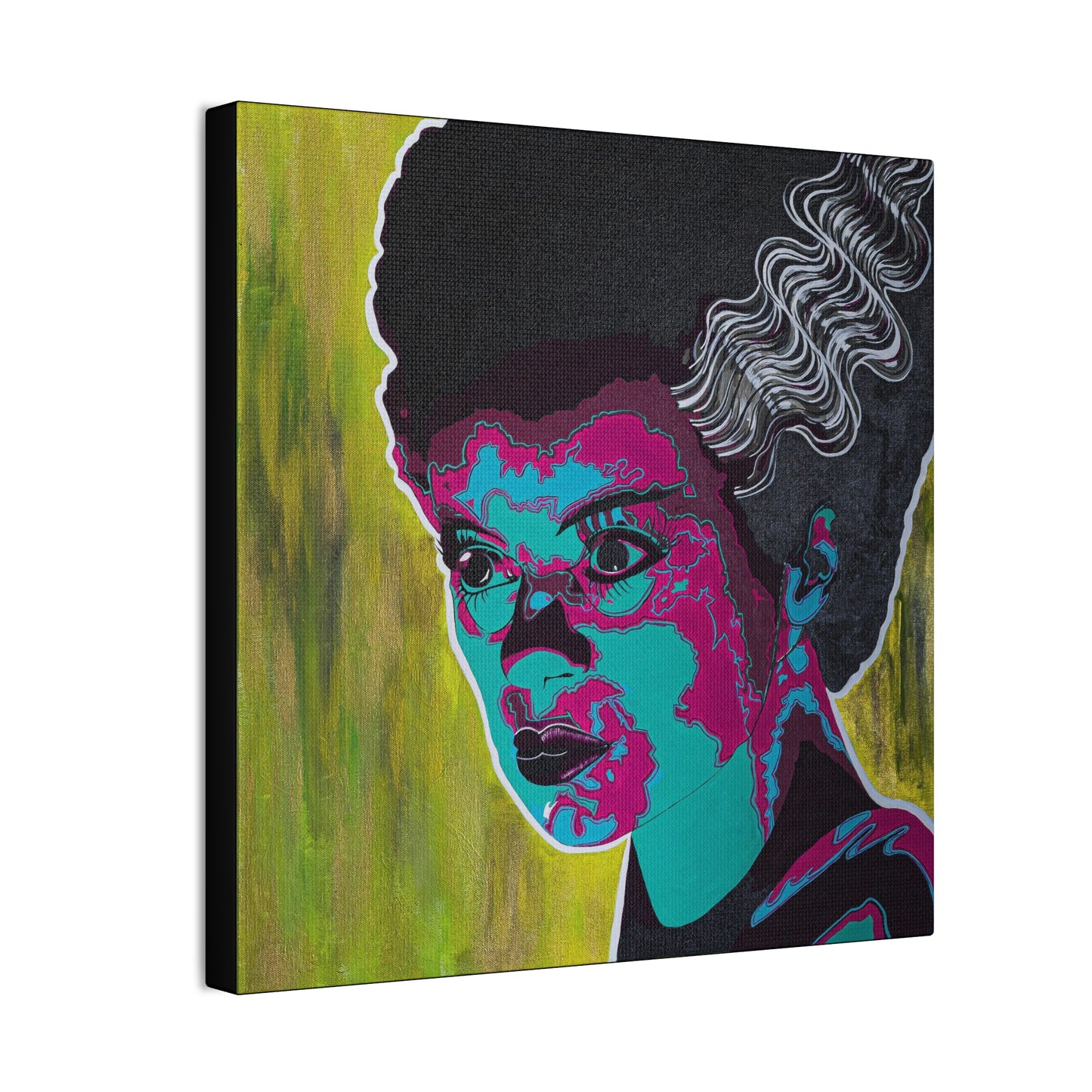 A canvas print of a woman with dark hair and colorful, stylized facial features.