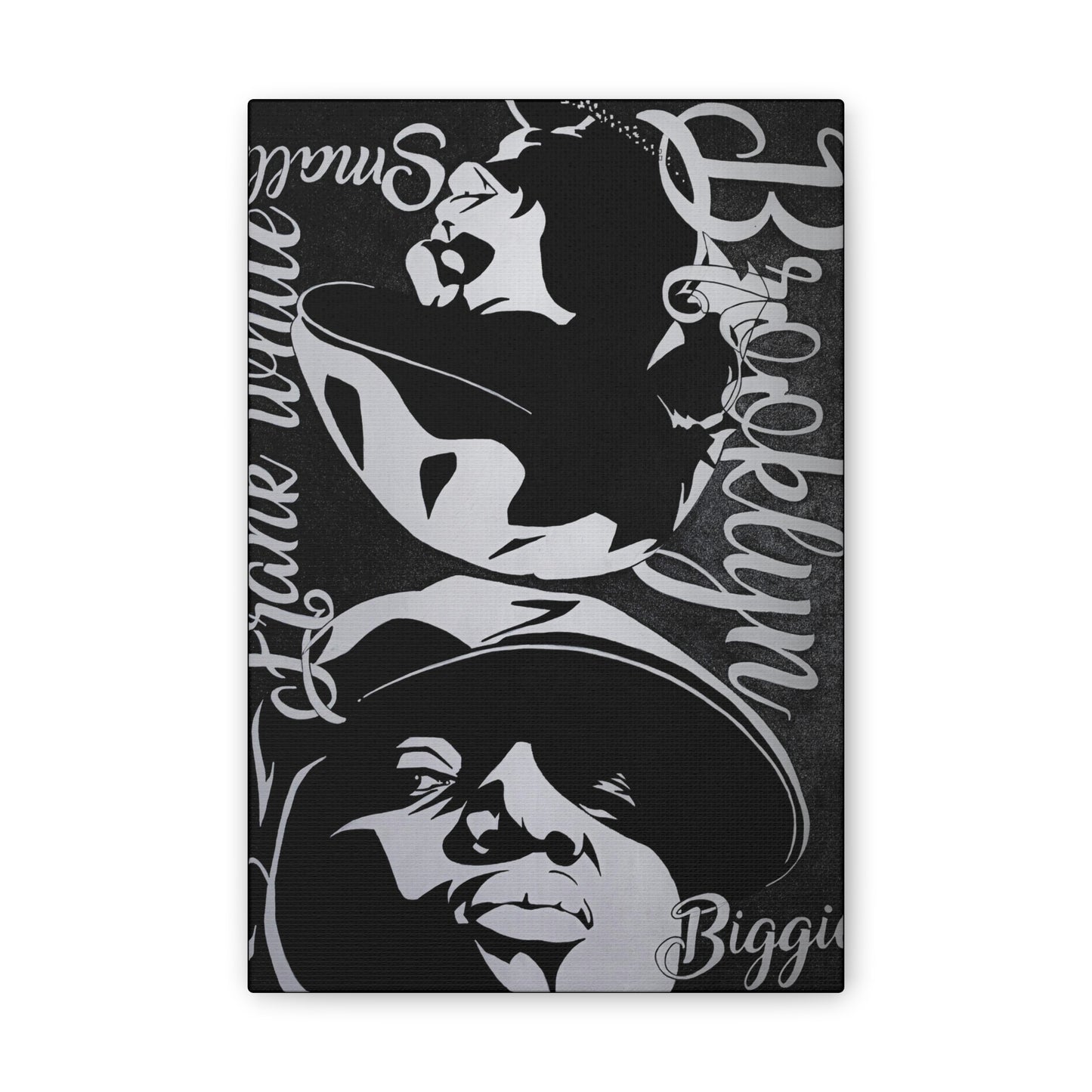 A black and white canvas print features portraits of Amy Winehouse and Biggie Smalls.