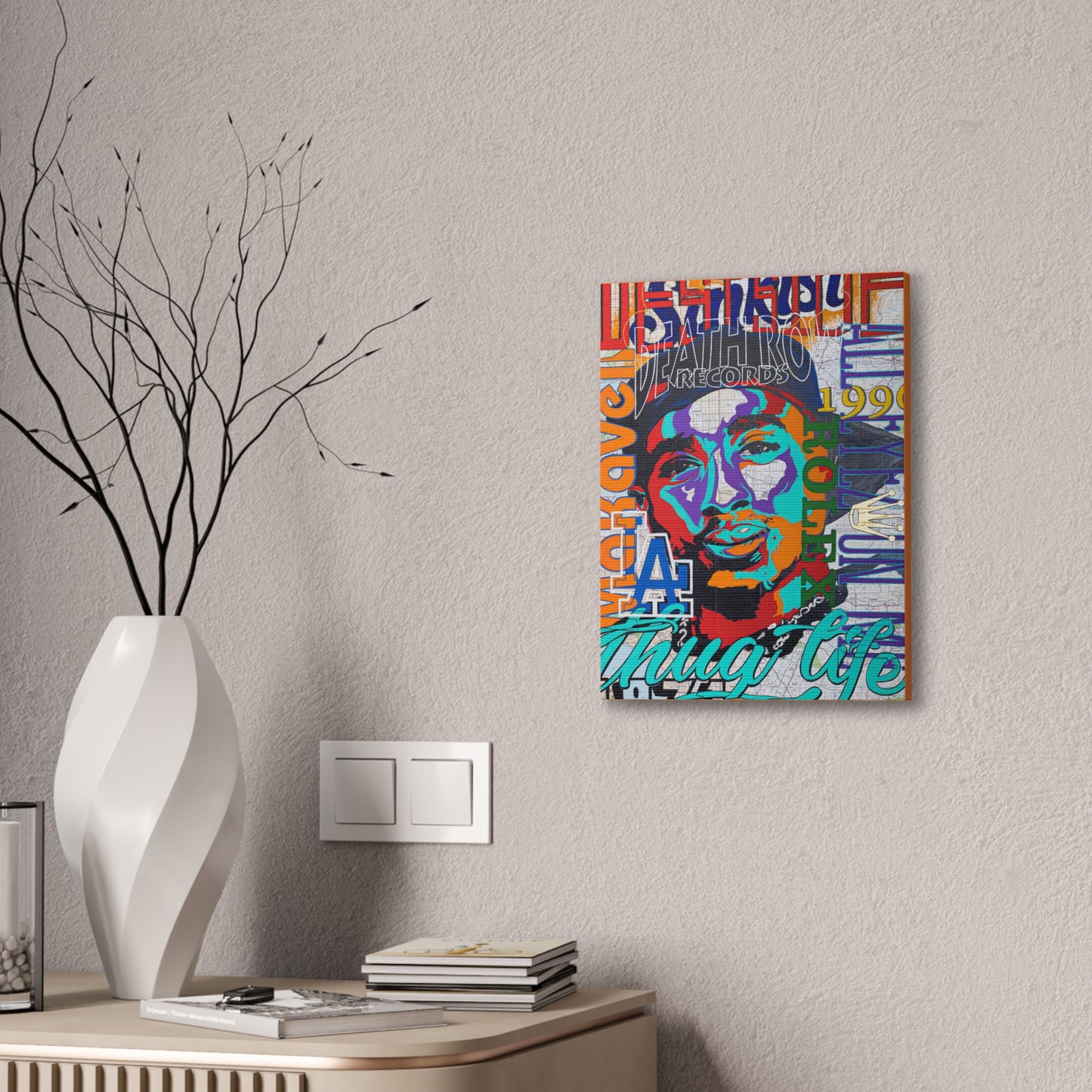 A colorful canvas gallery wrap featuring a pop art style portrait of Tupac Shakur.
