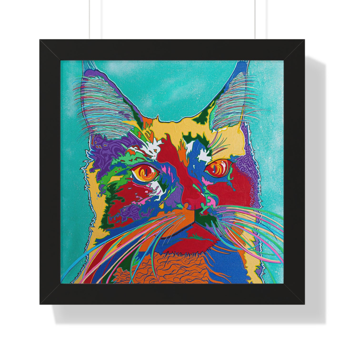 A framed poster features a colorful, pop-art style painting of a cat's face.