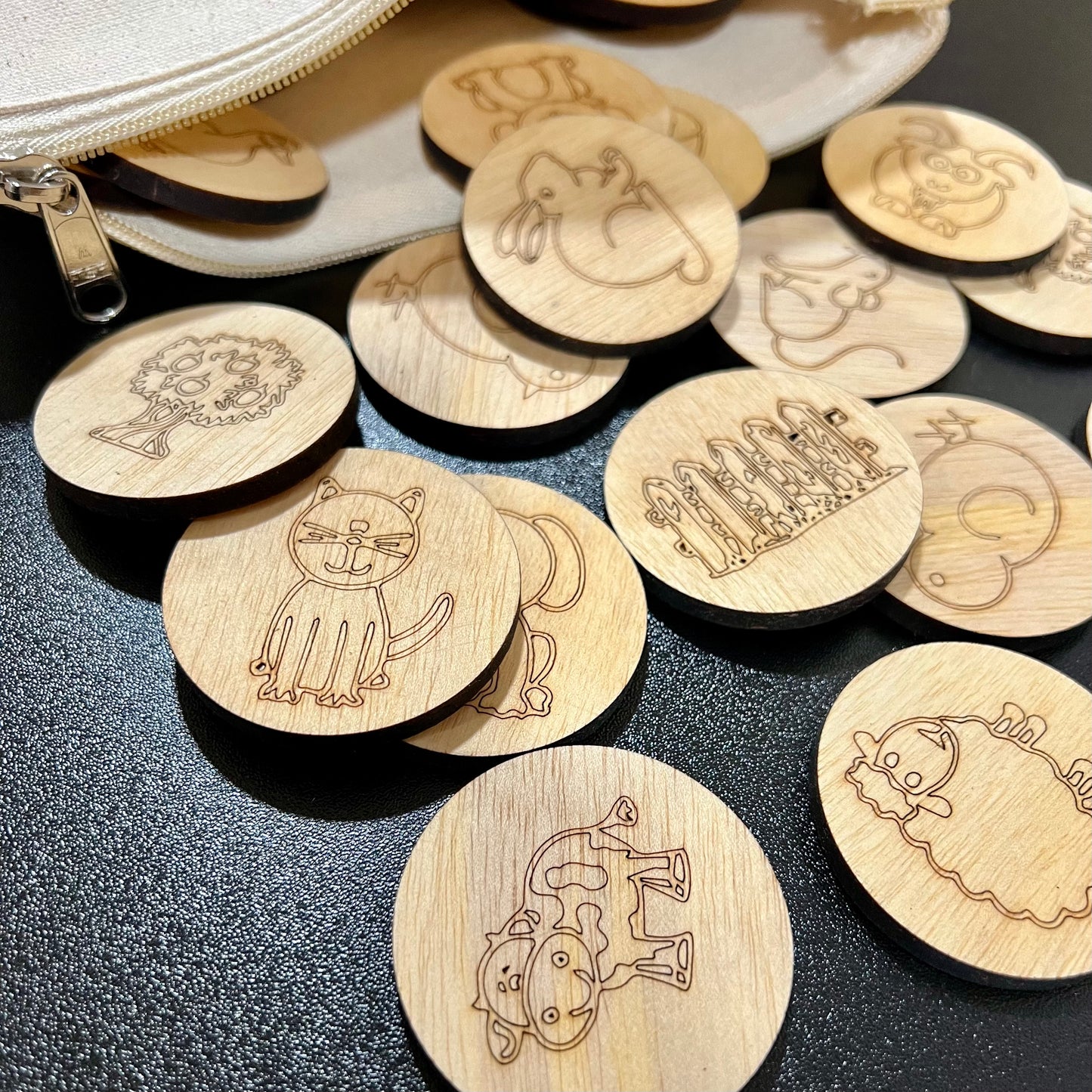 Wooden memory game with farm animal designs and a linen zipper bag.