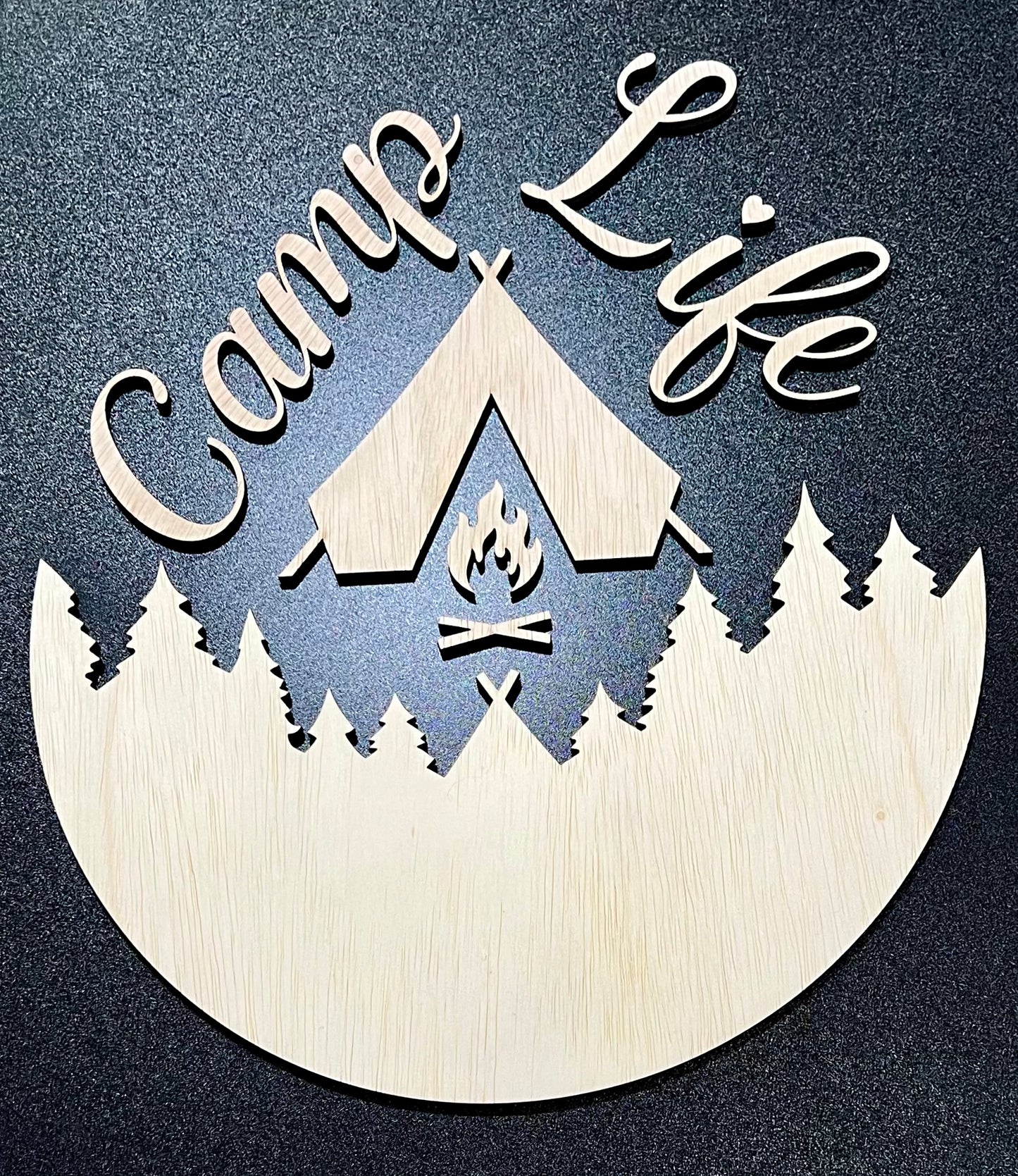 Unpainted wood sign featuring "Camp Life" text, a tent, campfire, and pine trees.