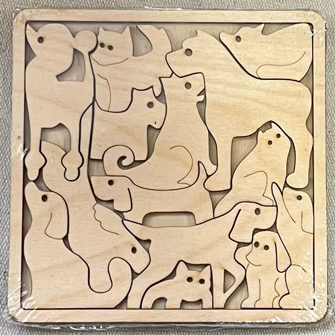 Unfinished wood square puzzle featuring various dog and cat shapes.