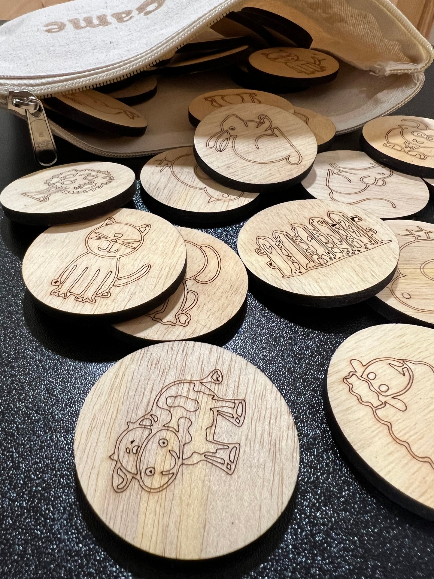Wooden memory game with farm animal designs and a linen zipper bag.