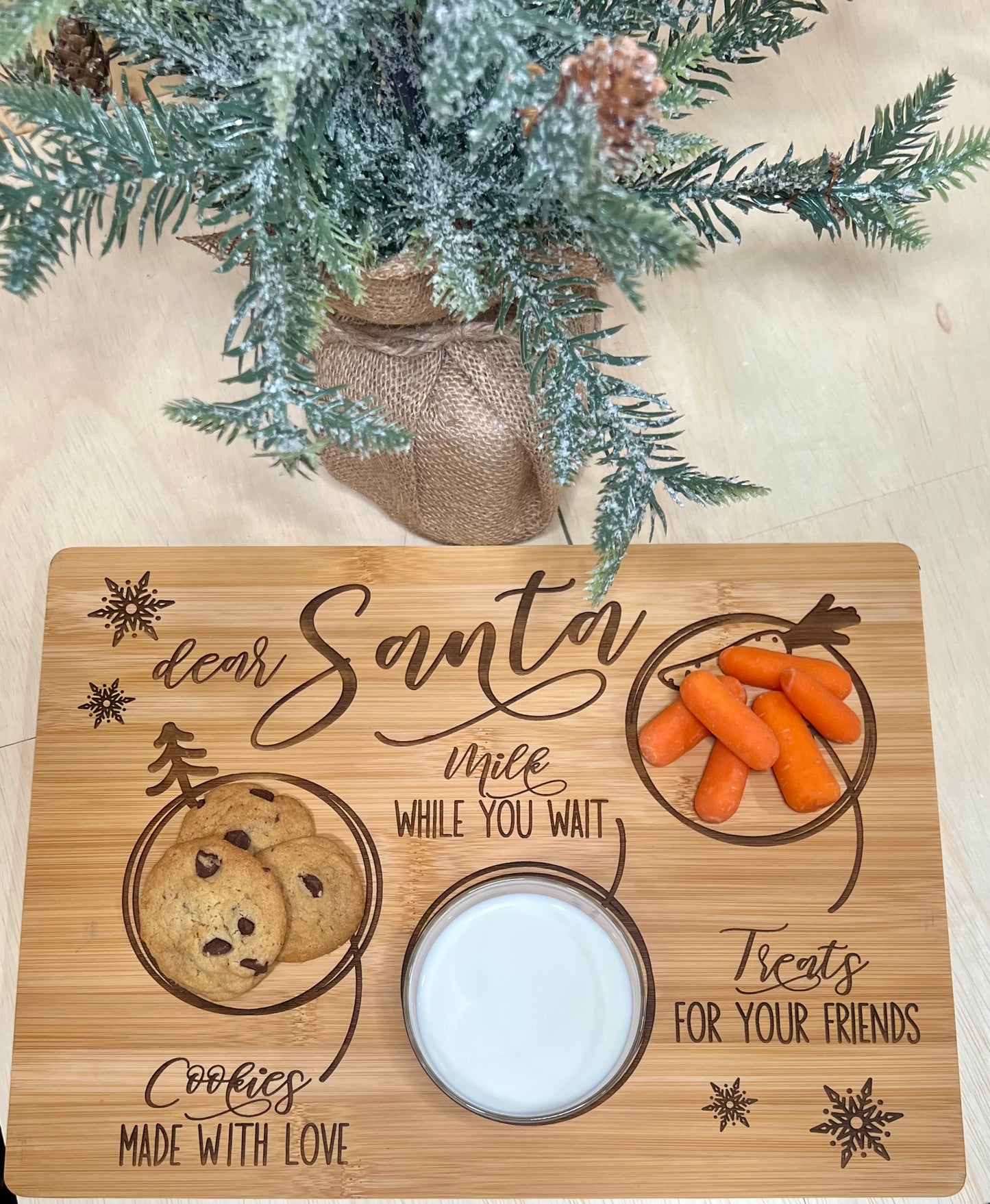Engraved bamboo "Dear Santa" tray with cookies, milk, and carrots.