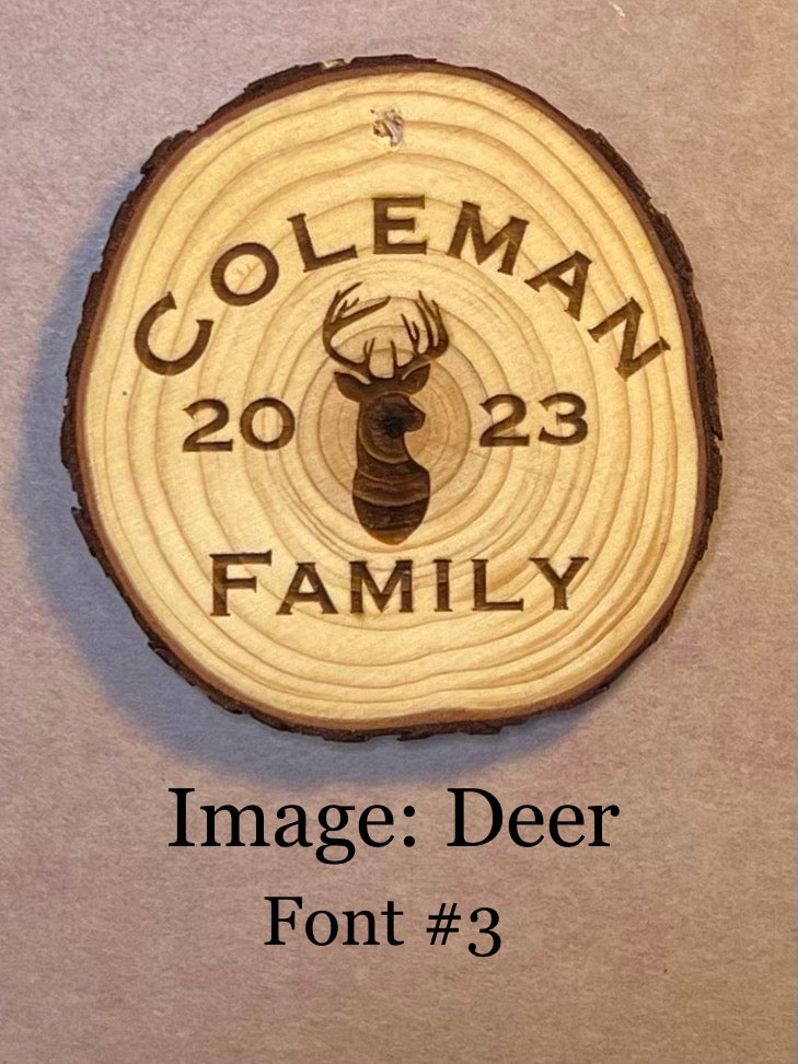 Personalized log wood round ornament engraved with "COLEMAN FAMILY 2023" and a deer image.