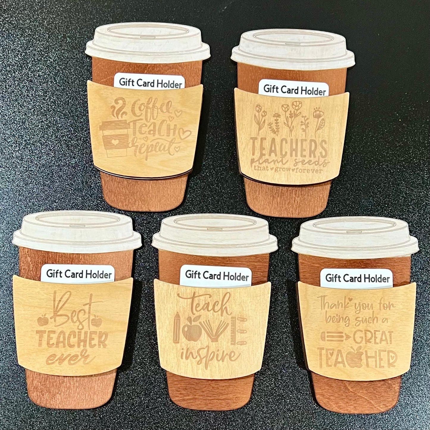 Five wooden coffee cup-shaped gift card holders with teacher-themed engravings.