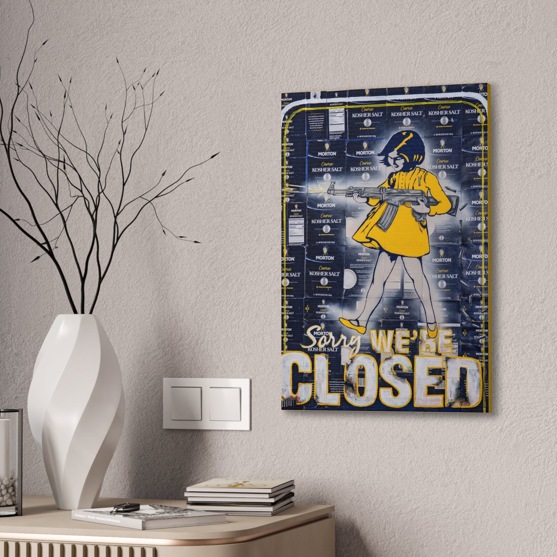 A canvas gallery wrap featuring a woman with a rifle and the text "Sorry, We're Closed."