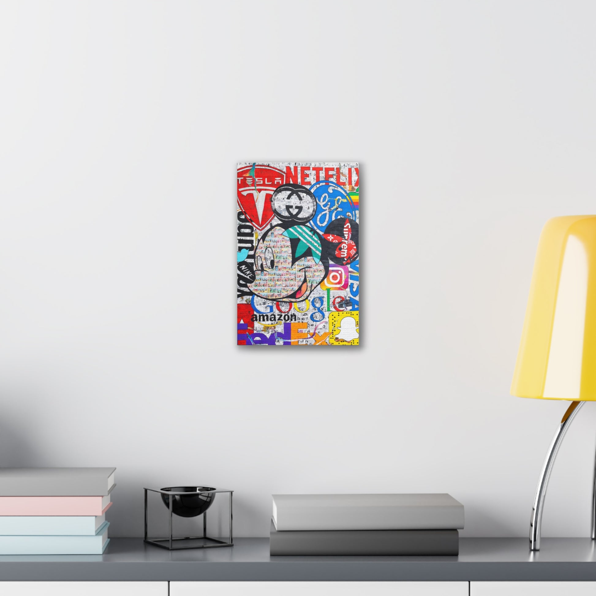 A canvas gallery wrap featuring a Mickey Mouse collage of brand logos.