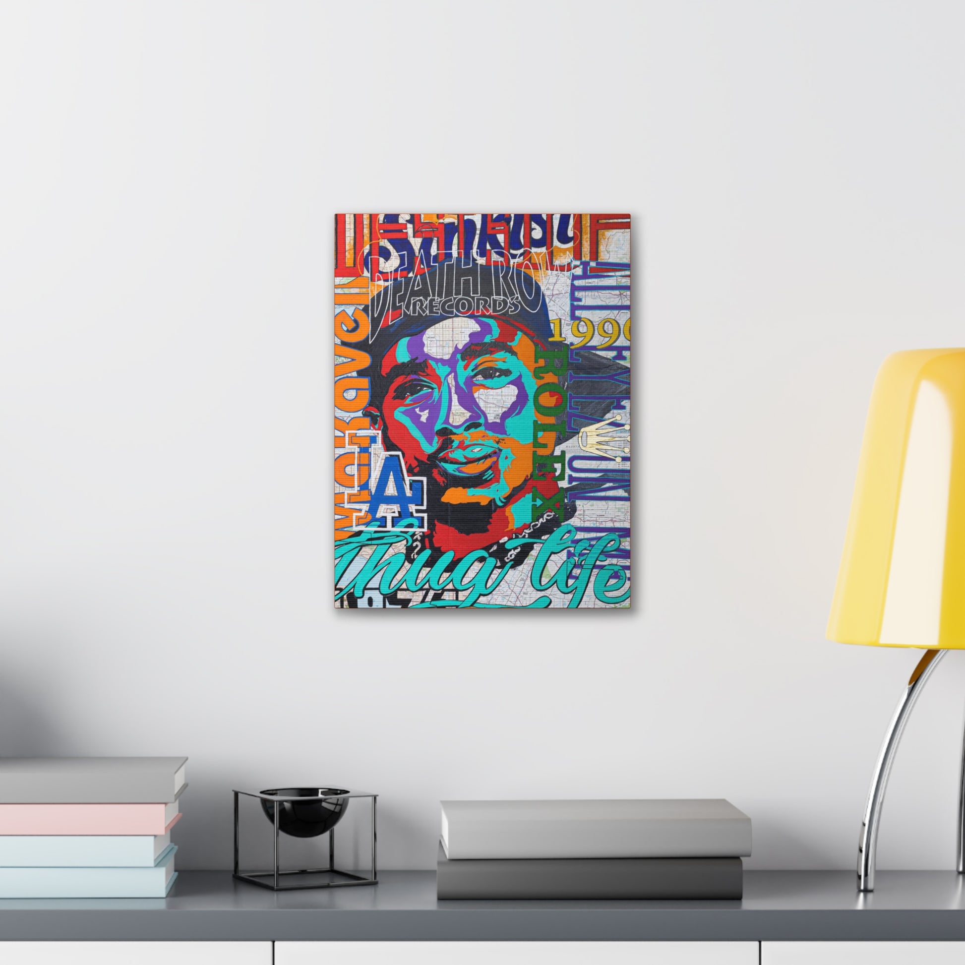 A colorful canvas gallery wrap featuring a pop art style portrait of Tupac Shakur.
