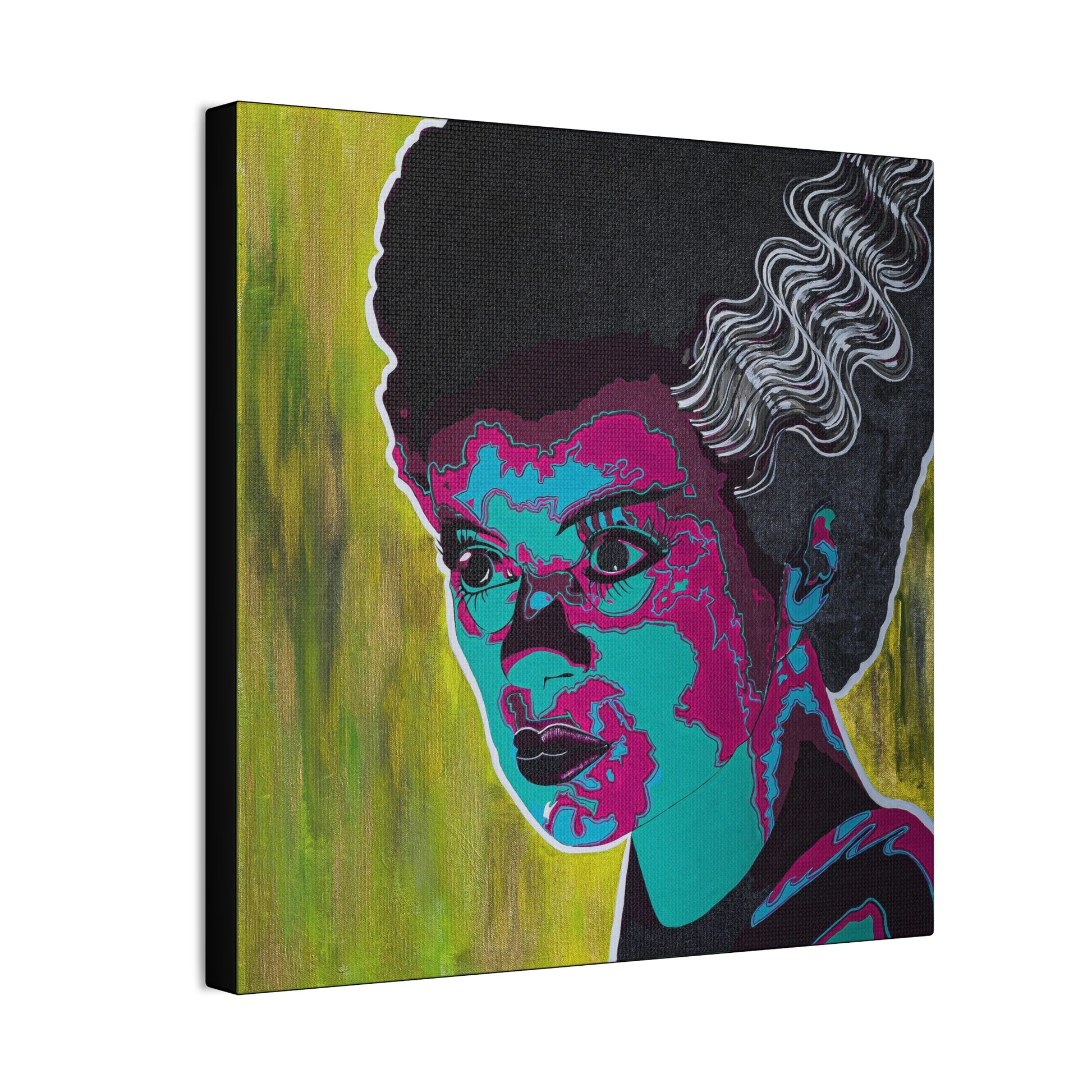 A canvas print of a woman with dark hair and colorful, stylized facial features.
