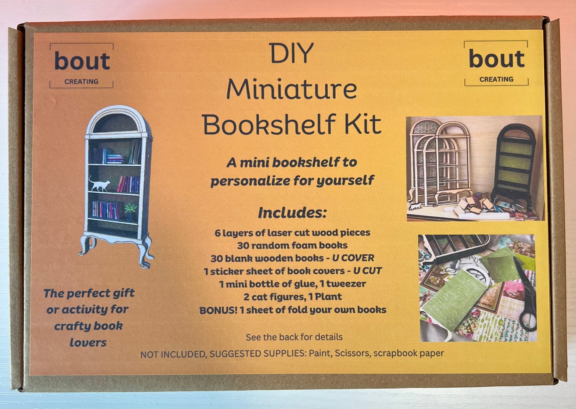 A DIY miniature bookshelf kit with laser-cut wood pieces and crafting supplies.