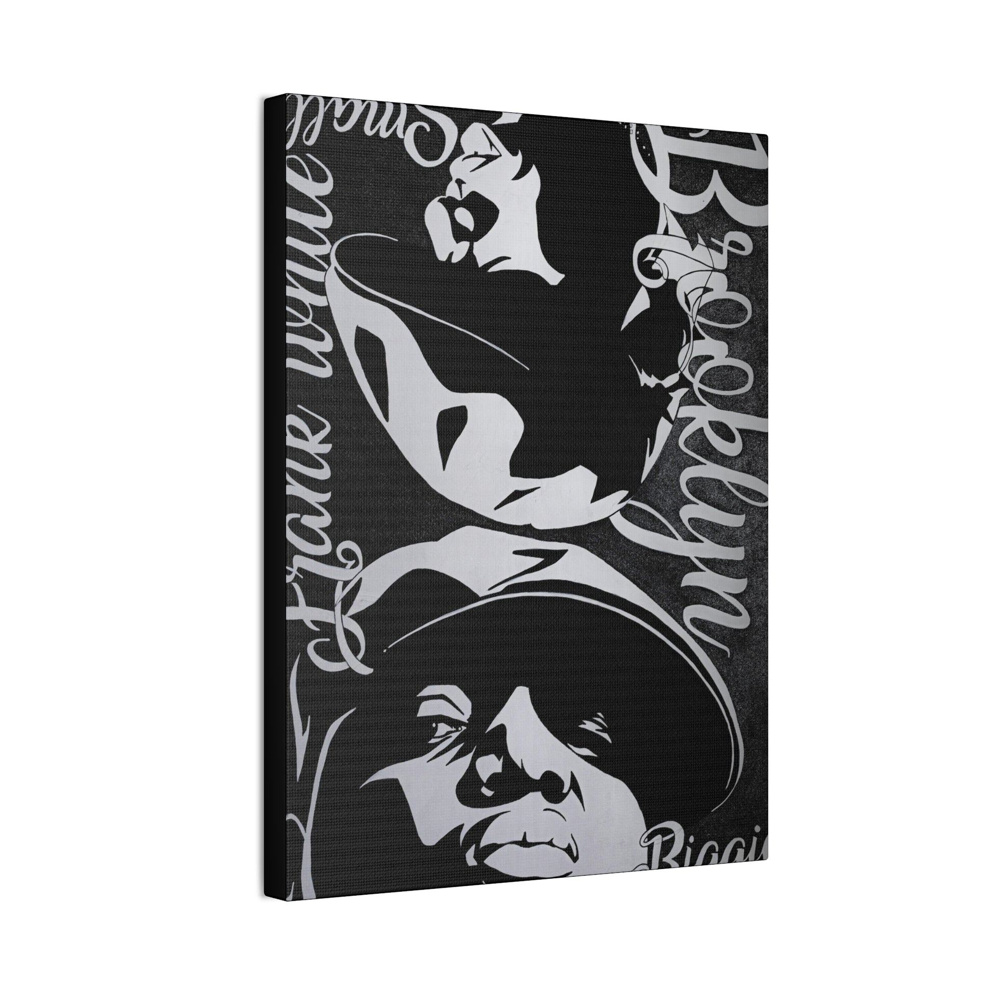 A black and white canvas print features portraits of Amy Winehouse and Notorious B.I.G.